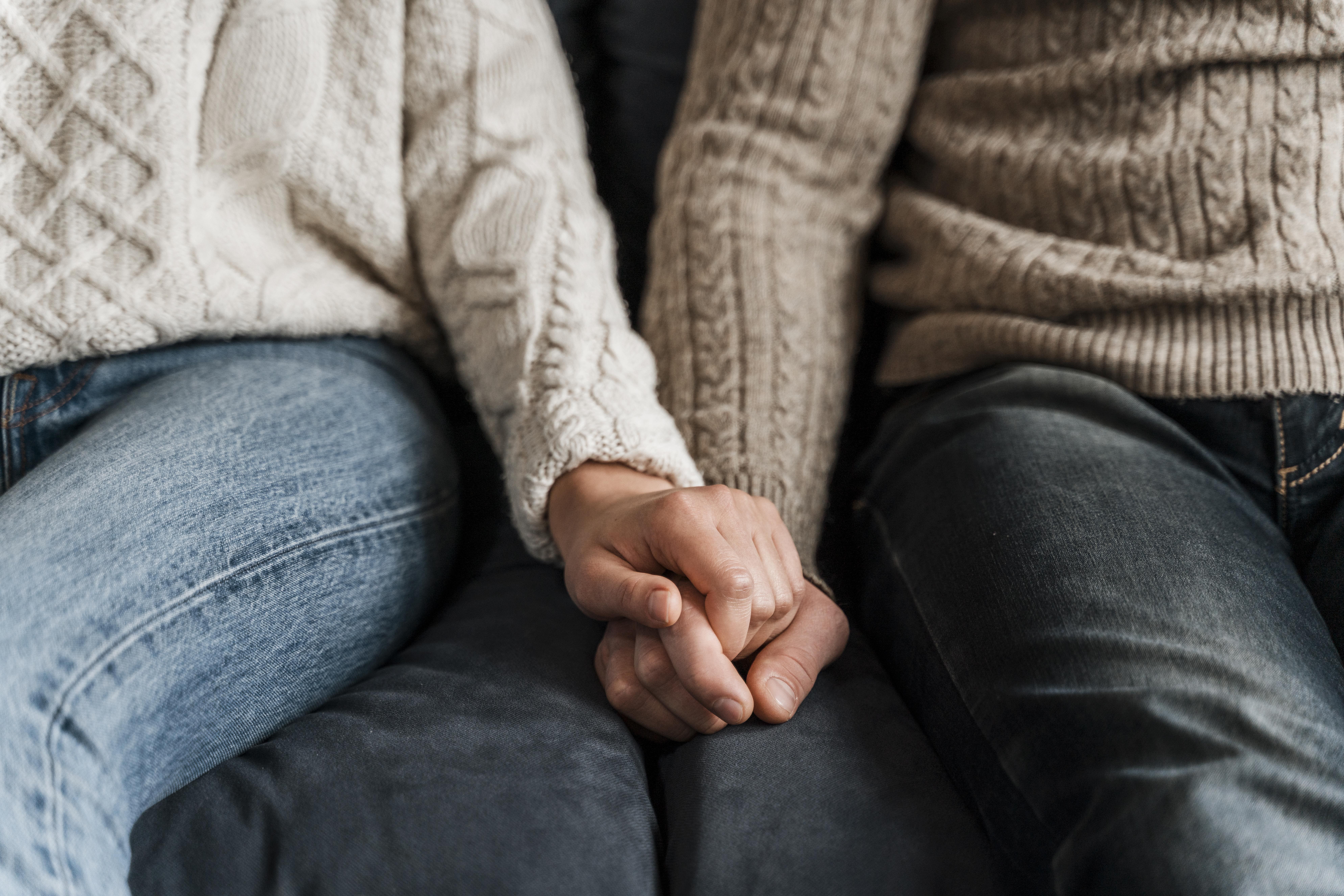 close up couple holding hands